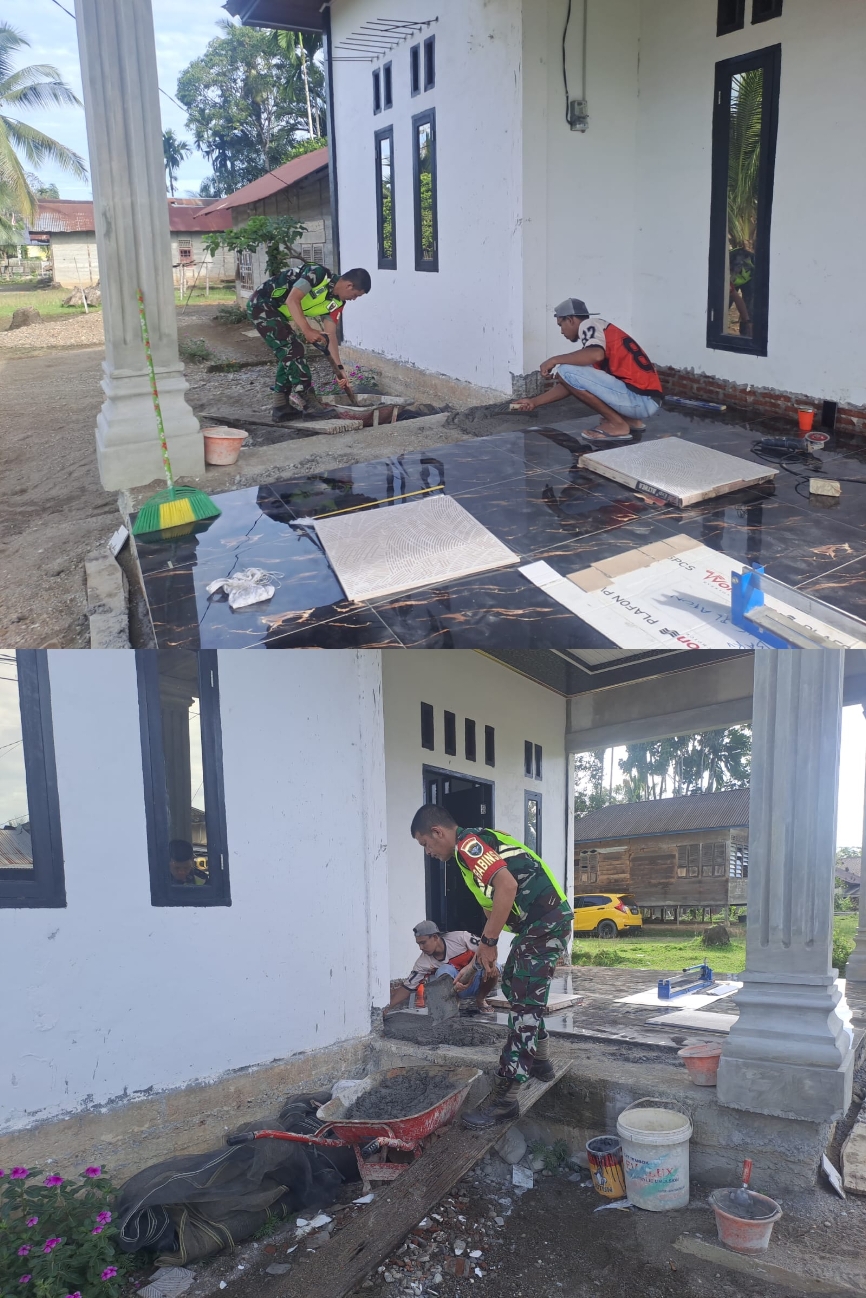 Sertu Iwan Bantu Warga Pasang Keramik Rumah